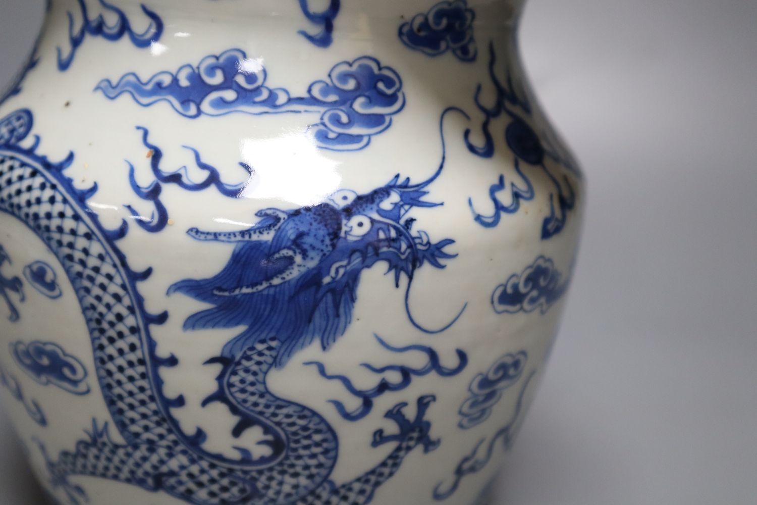 A 19th century Chinese blue and white dragon jug, 22cm